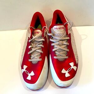 Under Armour red and white men baseball cleats, size 7